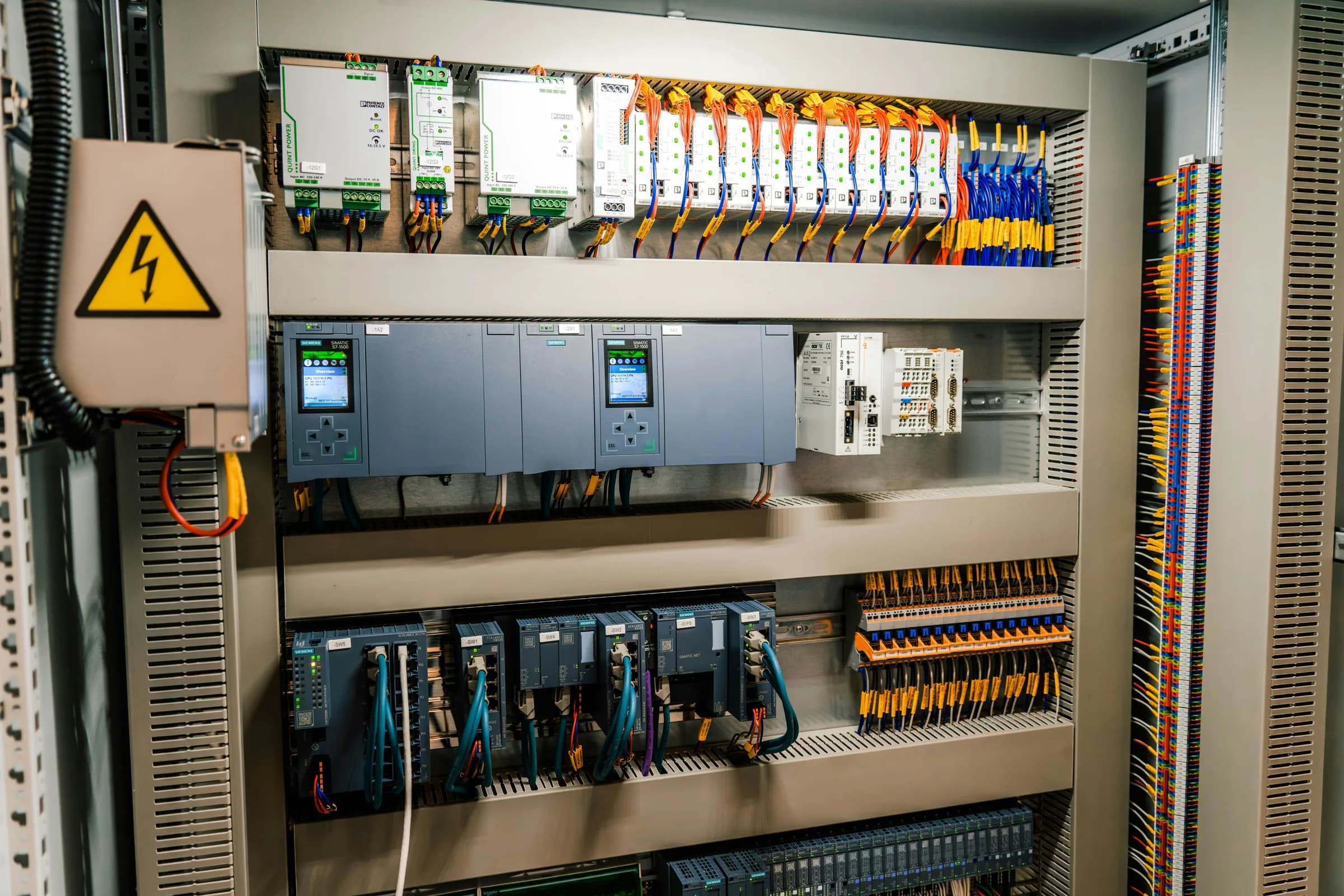 Commercial electrical control cabinet with switchgear and organized wiring.